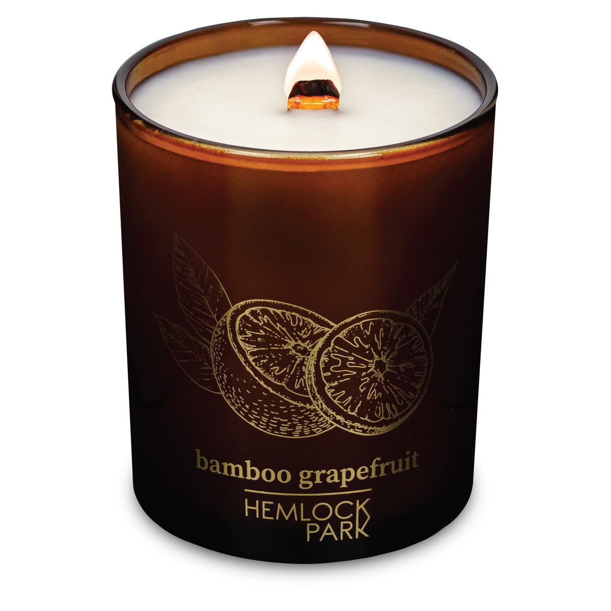 Hemlock Park Bamboo Grapefruit candle with wood wick showing a steady burn