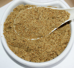 Herba Organica Milk Thistle Seeds Powder dispenser with a scoop illustrating versatile use in smoothies