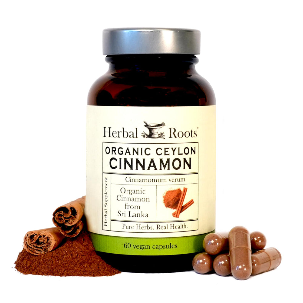 Herbal Roots Ceylon Cinnamon capsules bottle on wood for daily immune-support routine.