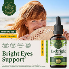 Herbamama Eyebright tincture dropper dispensing into water for easy consumption.