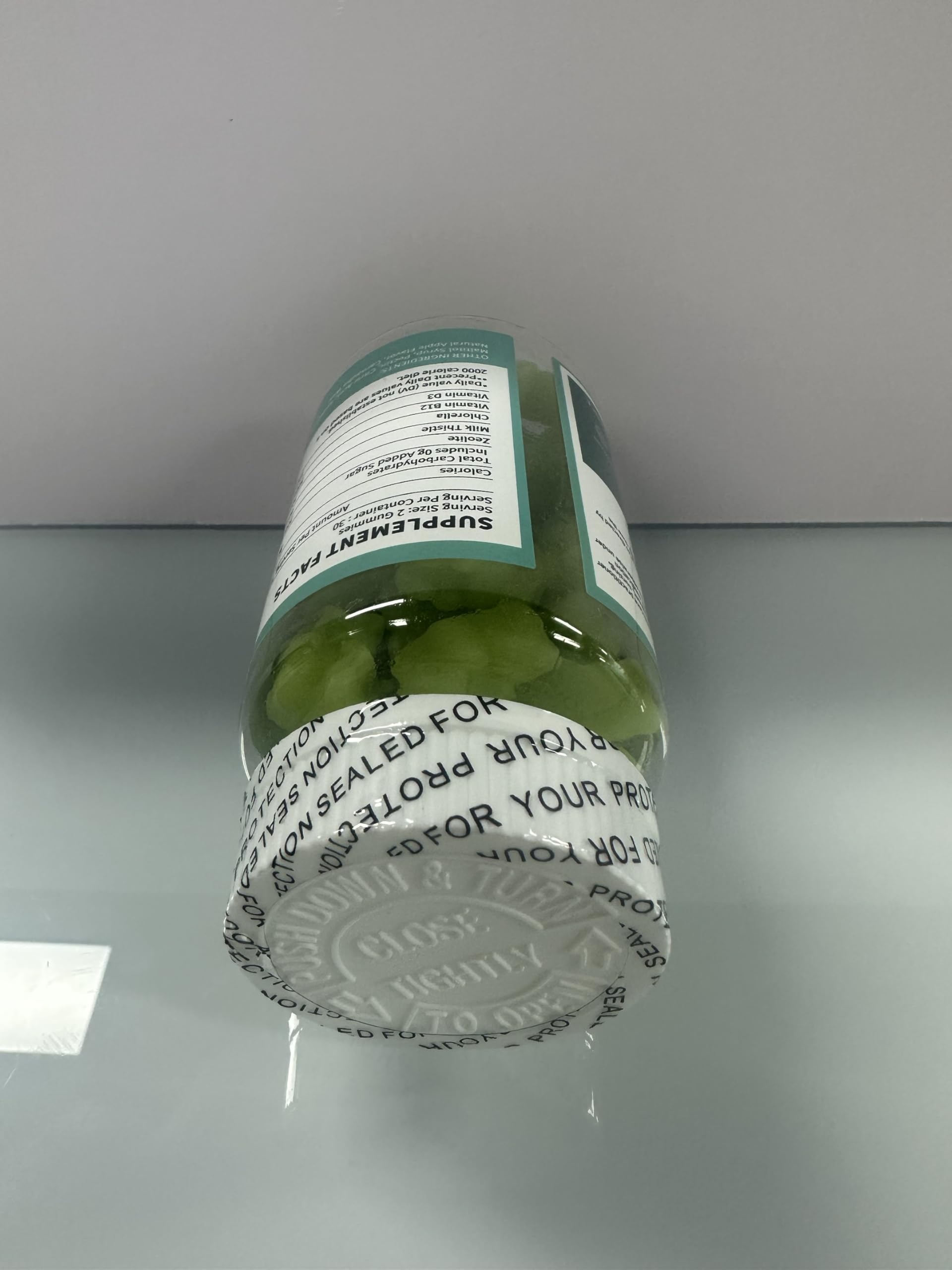 Ingredient close-up highlights chlorella present for natural elimination support.