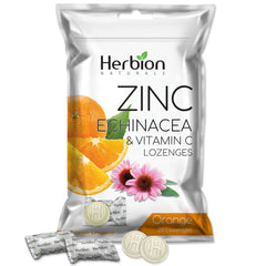 Close-up of HOLZ: HERBION lozenges texture showing candy-like consistency.