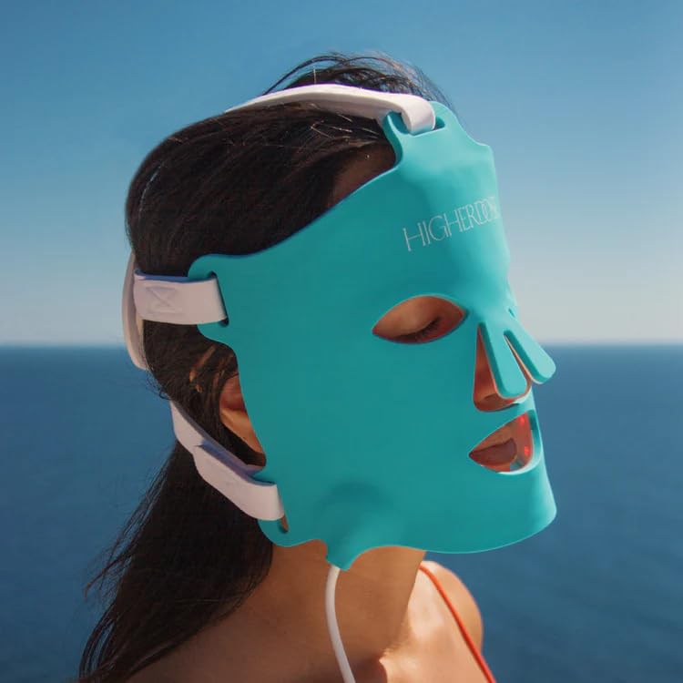 HigherDOSE face mask worn on the face for cordless, comfortable LED therapy.