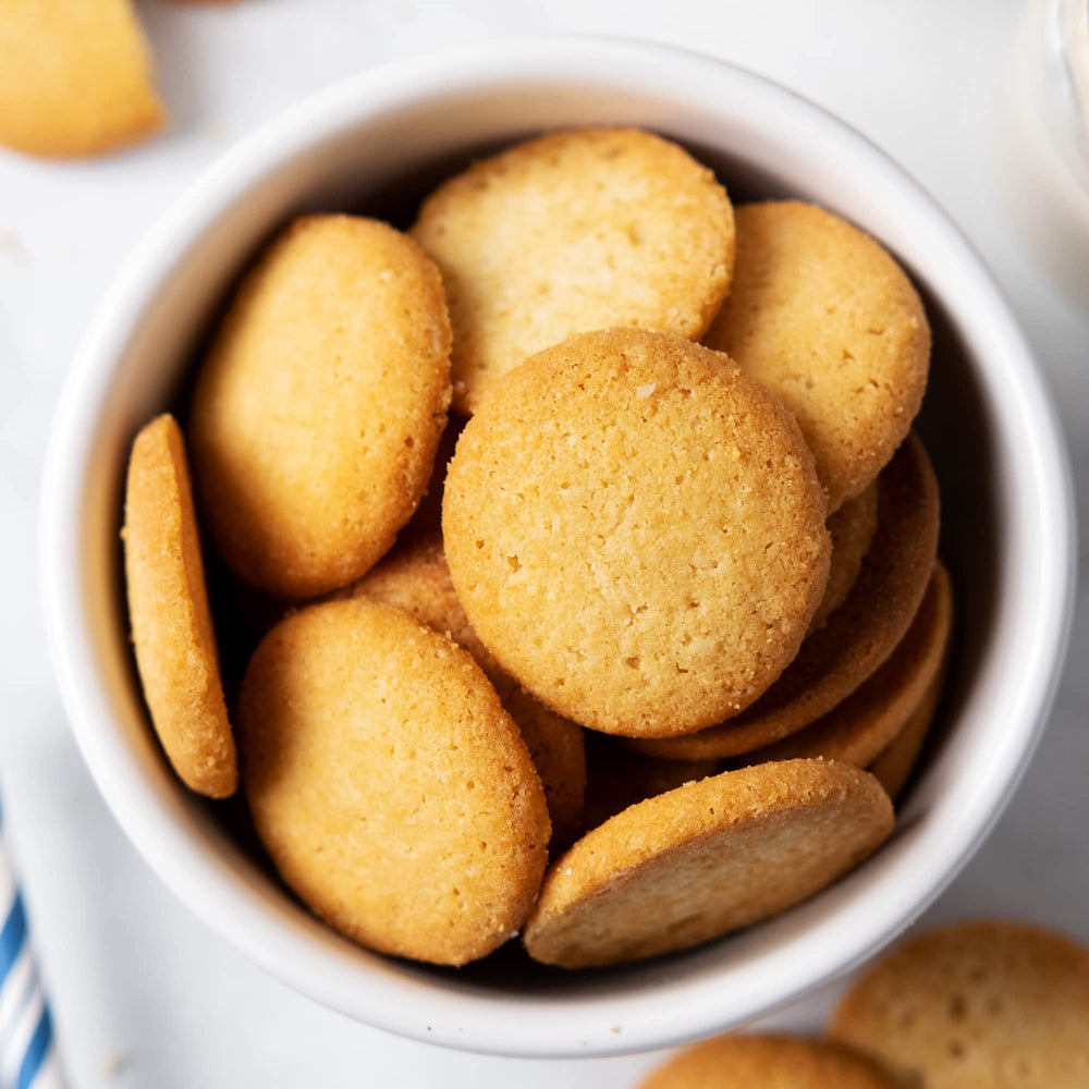 Kids enjoying HighKey vanilla wafer cookies as a tasty treat.