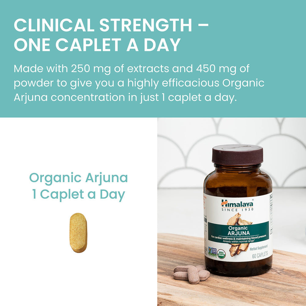 Himalaya Arjuna daily-dose caplets with glass of water.