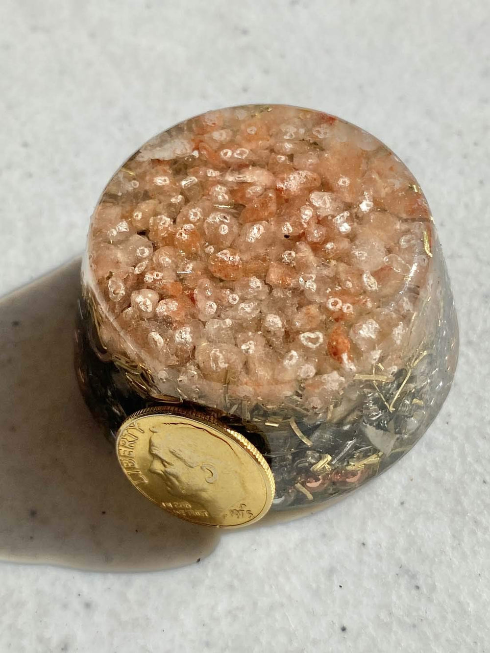 Himalayan Pink Salt Single Crystal Tower Buster Orgone Generator garden view showcases energizing ambiance for outdoor spaces