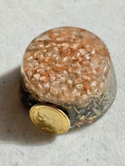 Himalayan Pink Salt Single Crystal Tower Buster Orgone Generator garden view showcases energizing ambiance for outdoor spaces