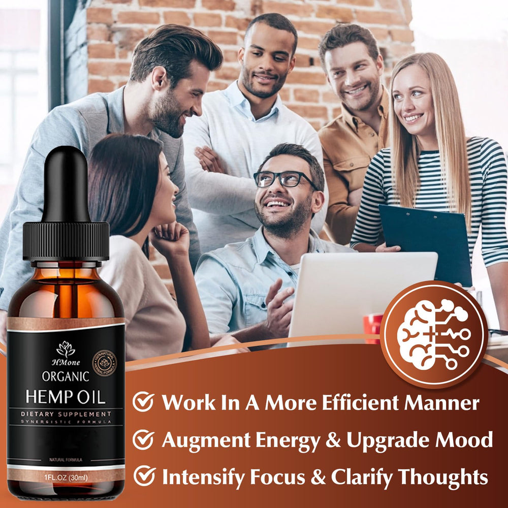 HMone hemp oil drops pouring into teaspoon for precise dosing.