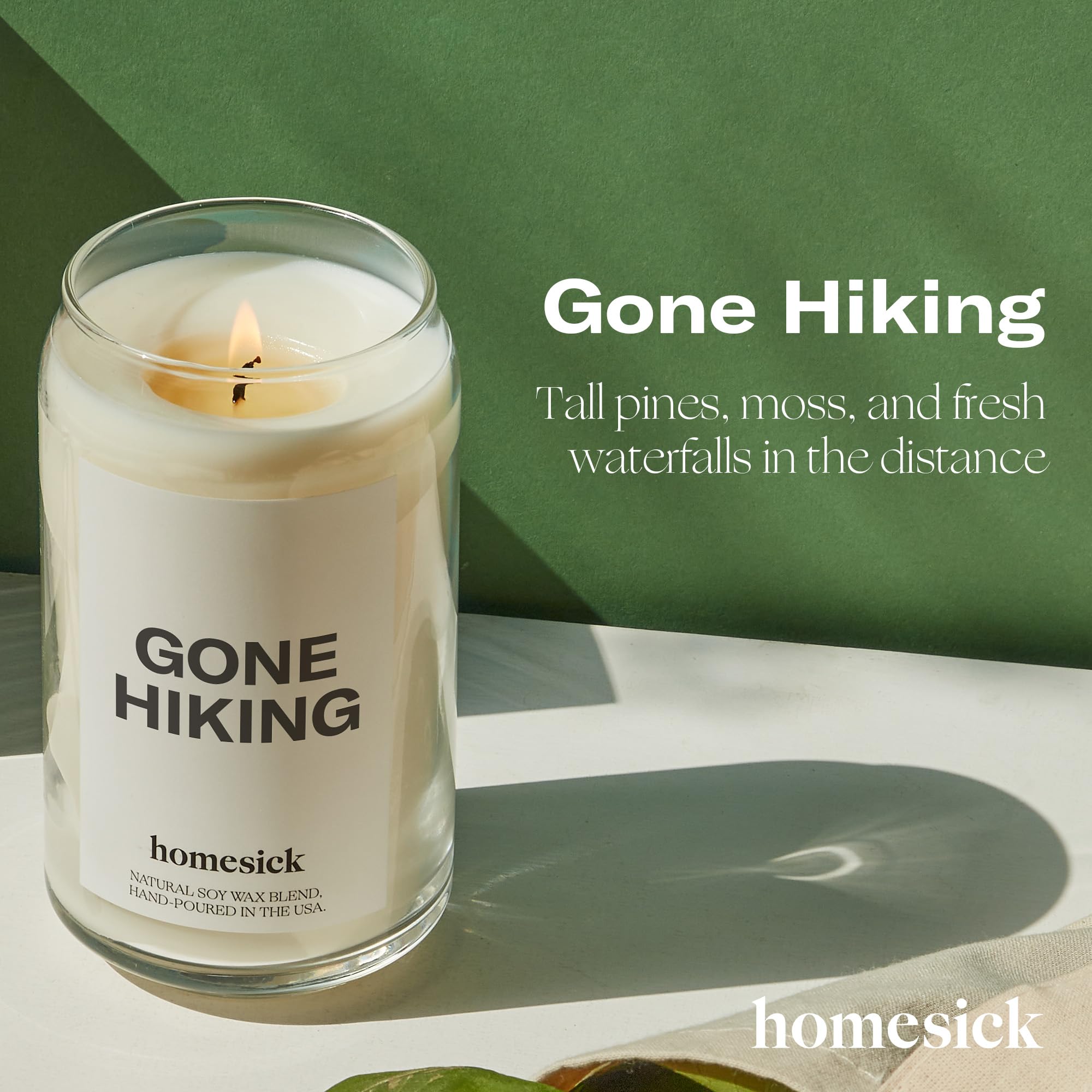 Homesick Gone Hiking candle jar with wood tone adds premium design to any room.