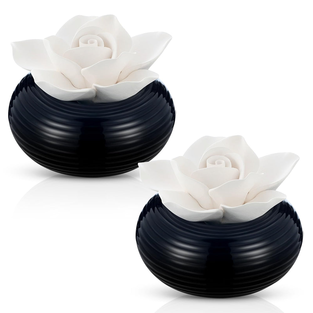 Honeydak Camellia diffuser with ceramic rose-top releasing a gentle aroma