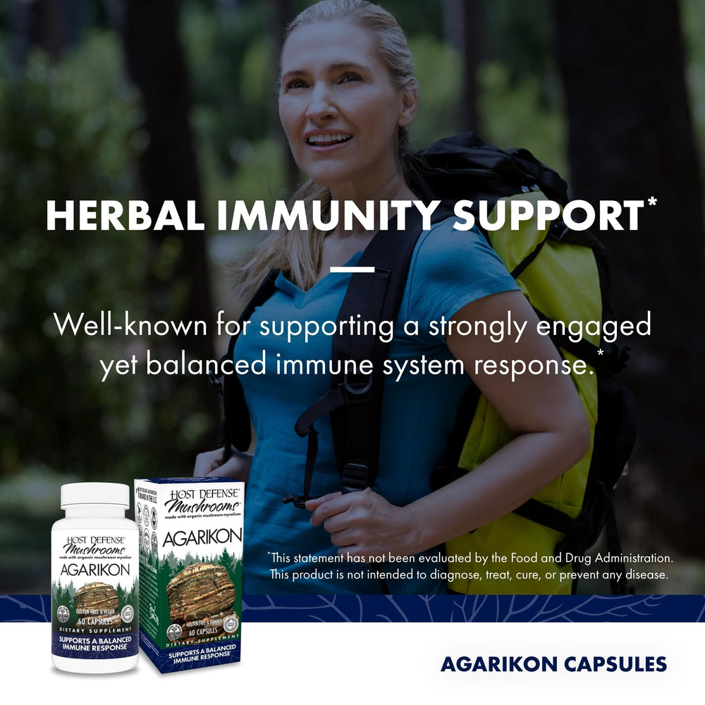 Host Defense Agarikon capsules with a glass of water for easy daily intake