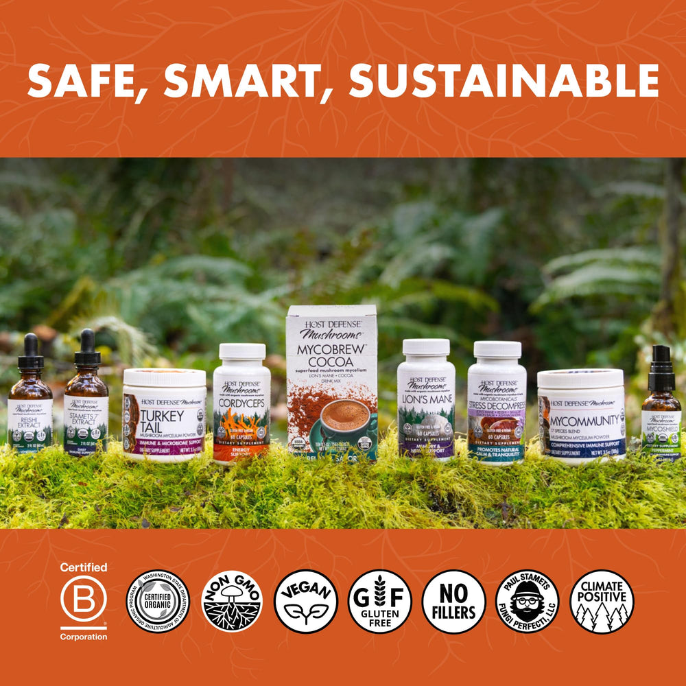 Person taking Host Defense capsules during workout or daily routine.
