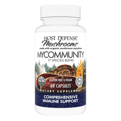 Host Defense MyCommunity bottle on a wooden surface for daily immune routine.