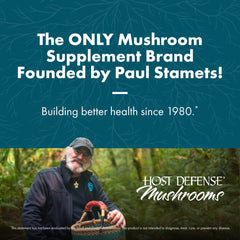 Host Defense Reishi capsules on spoon ready for daily wellness routine