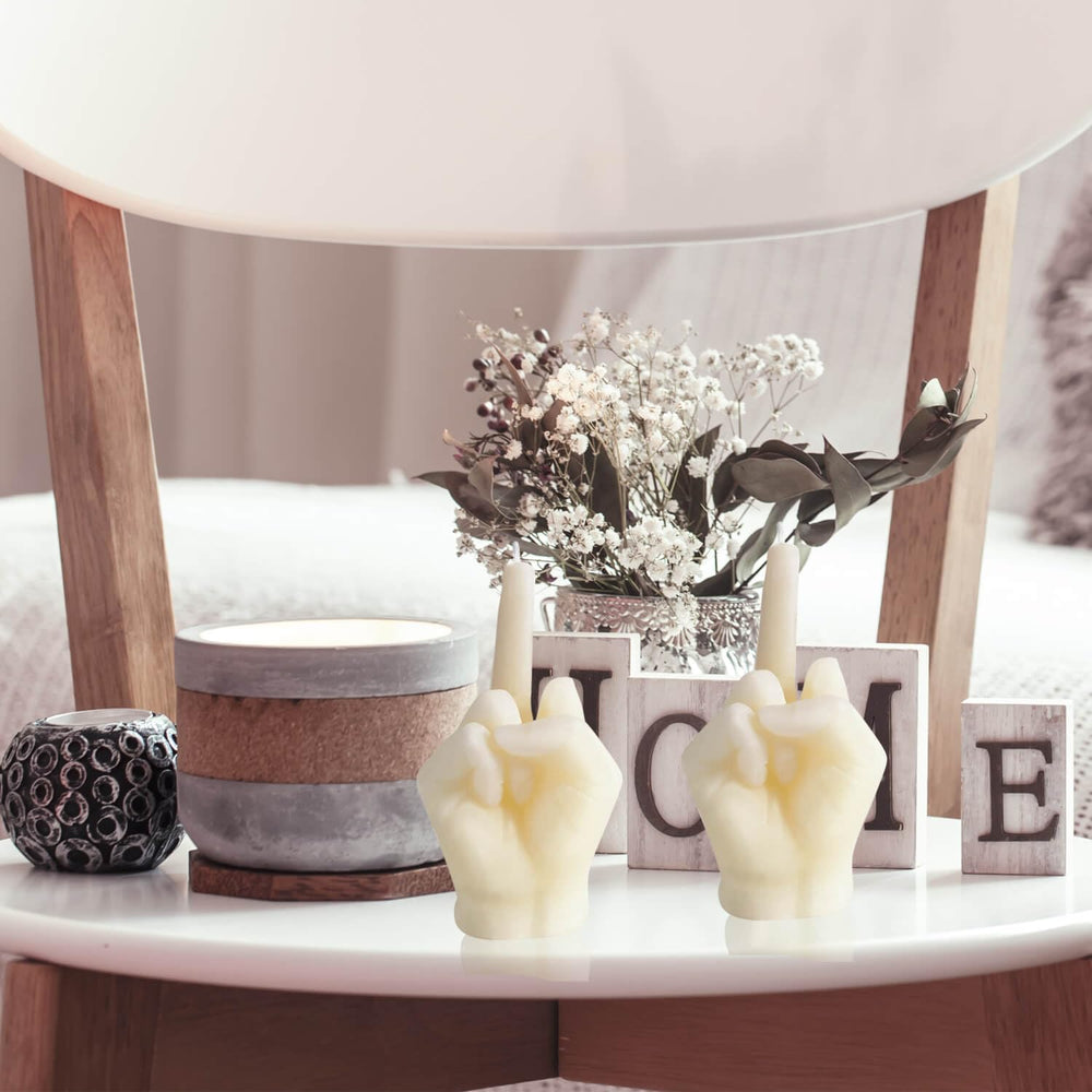 Hozodusi hand-gesture candle closeup showcases quirky decor with cozy vibes.