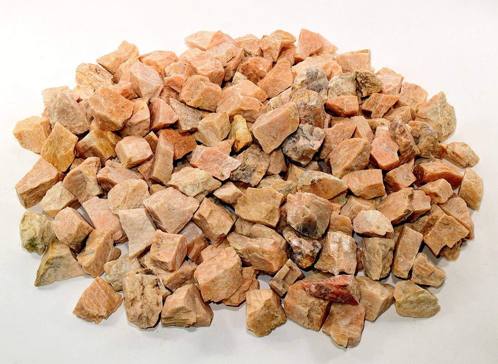 HQRP Peach Moonstone rough stones held in hand for scale and texture