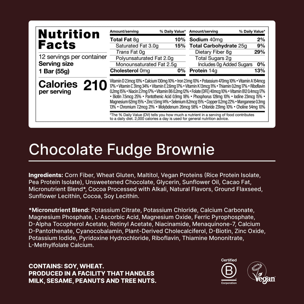 Huel fudge brownie bar broken open for a high-protein, fiber-rich bite