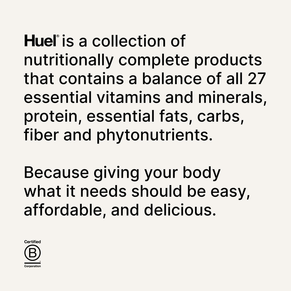 Lifestyle shot of Huel Daily Greens with glass and produce.