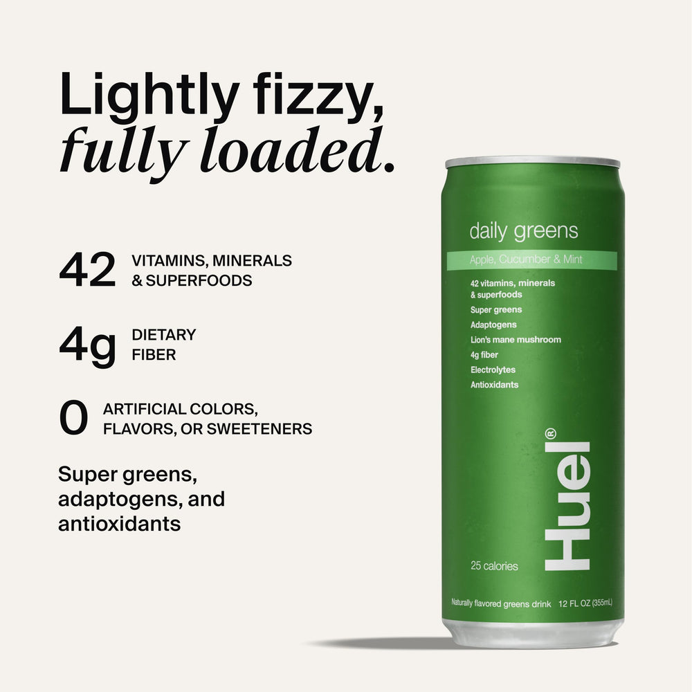 Pouring Huel Daily Greens into a glass for a fruity morning boost