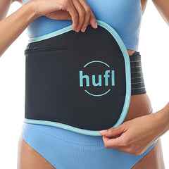 HUFL Castor Oil Pack Wrap on stomach for a gentle, comfortable wellness routine.