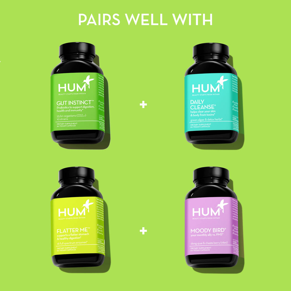 HUM Gut Instinct bottle with wellness items to suggest immune-support potential