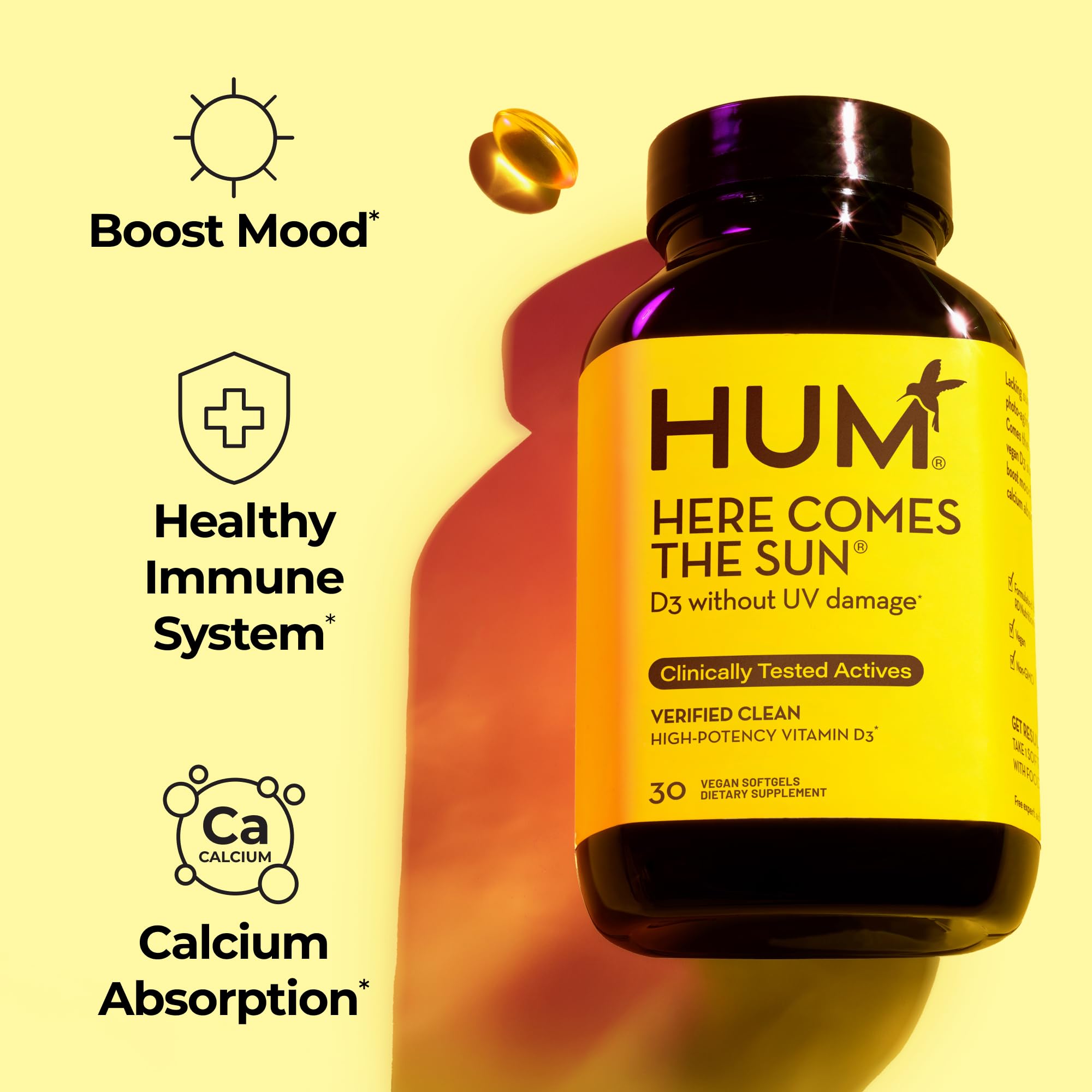 Close-up of HUM Here Comes The Sun vegan D3 softgels.