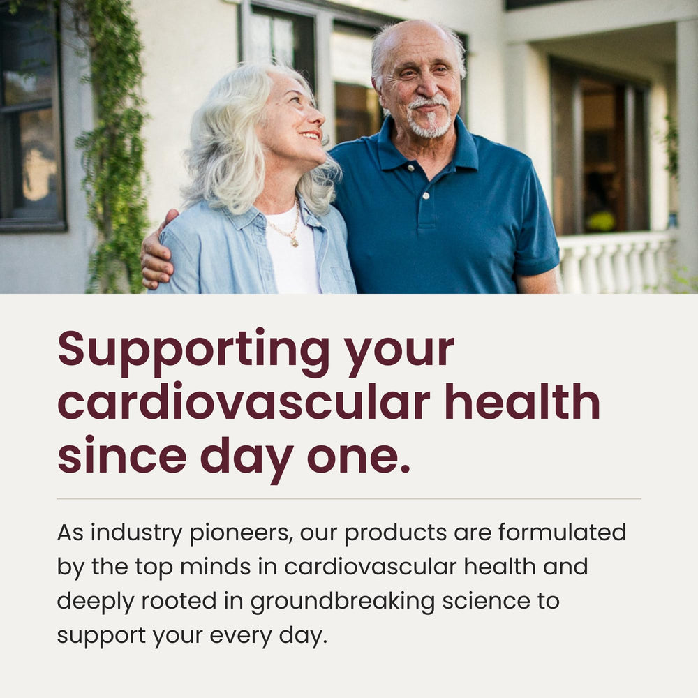 Humann SuperBeets Heart tablets on kitchen counter next to a glass of water