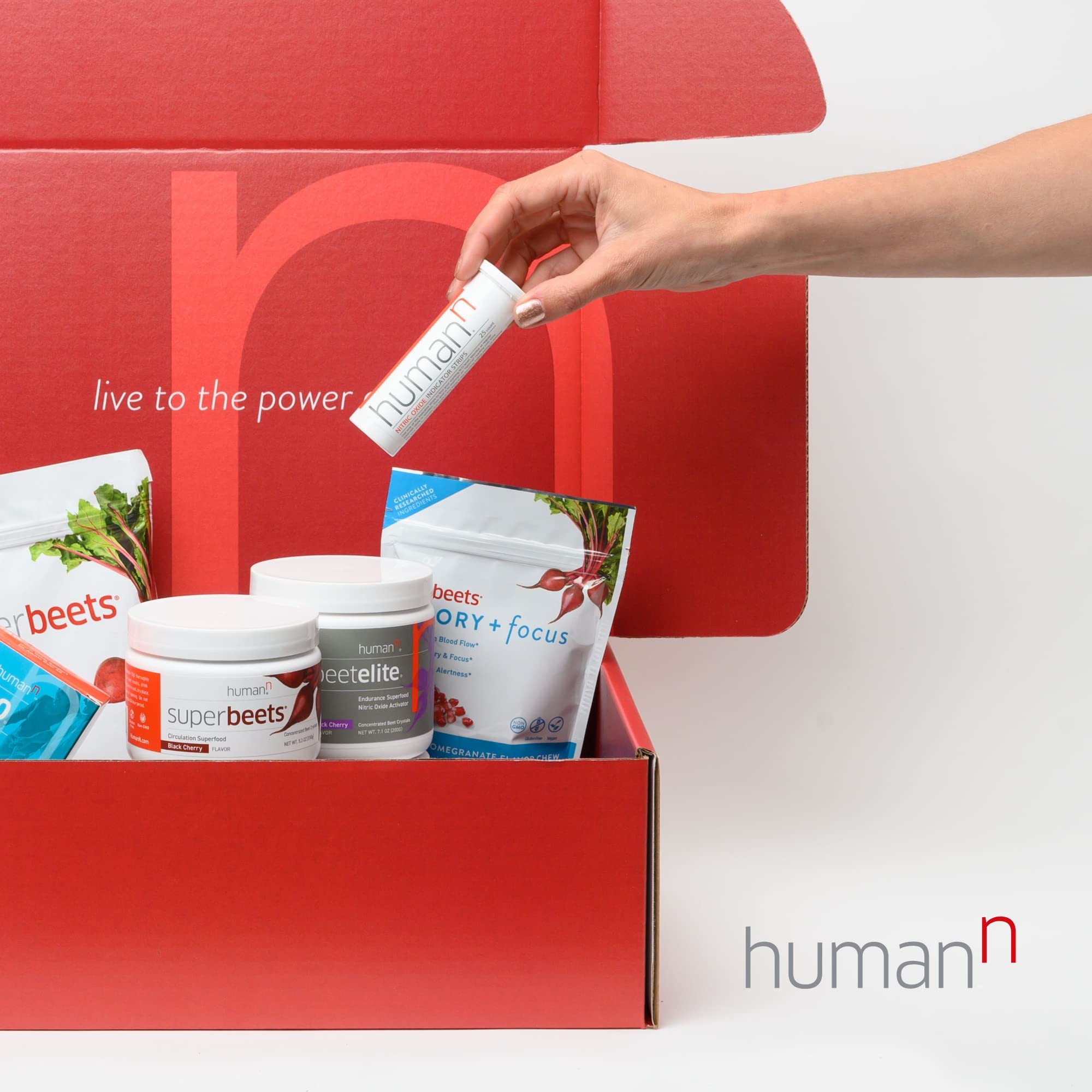 Humann SuperBeets Energy Plus bottle pour demonstrates convenient one-teaspoon serving