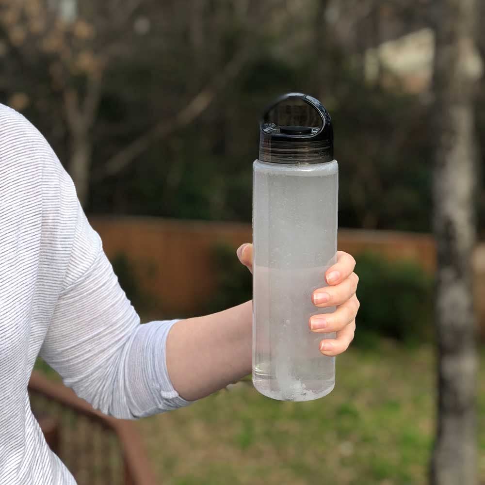HydroTab bottle pouring into water illustrating simple daily hydration.