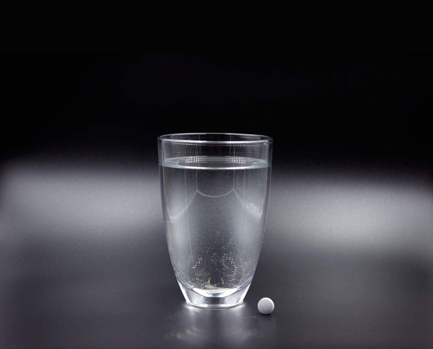 In-use HydroTab glass setup showing hydration support during activity.