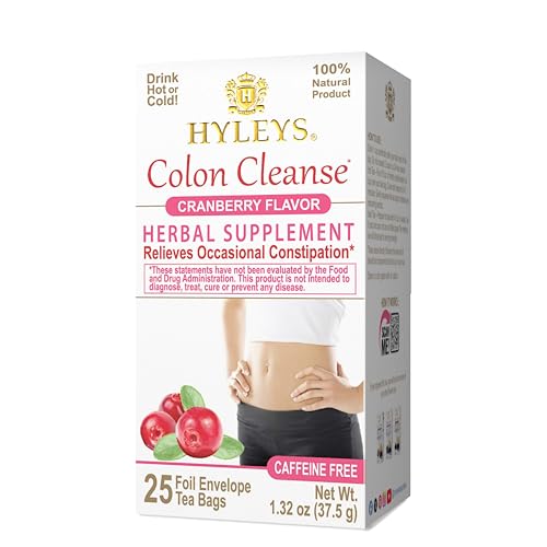 Hyleys Cranberry-infused herbal tea on desk beside fruits and water