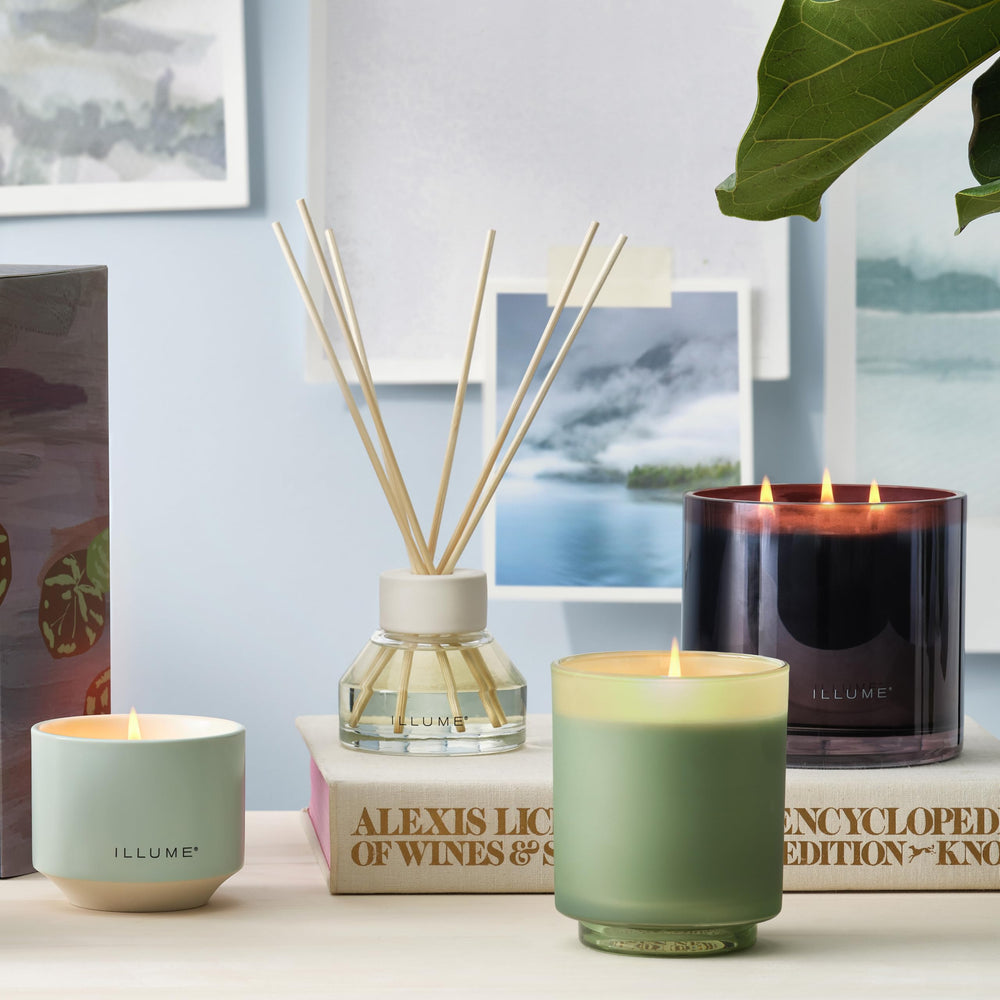 Illume diffuser placed in a cozy living room setting
