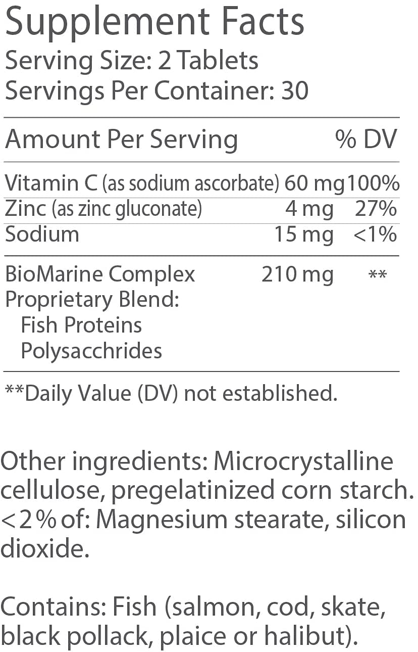 Holding Imedeen Derma One bottle for easy daily aging support.