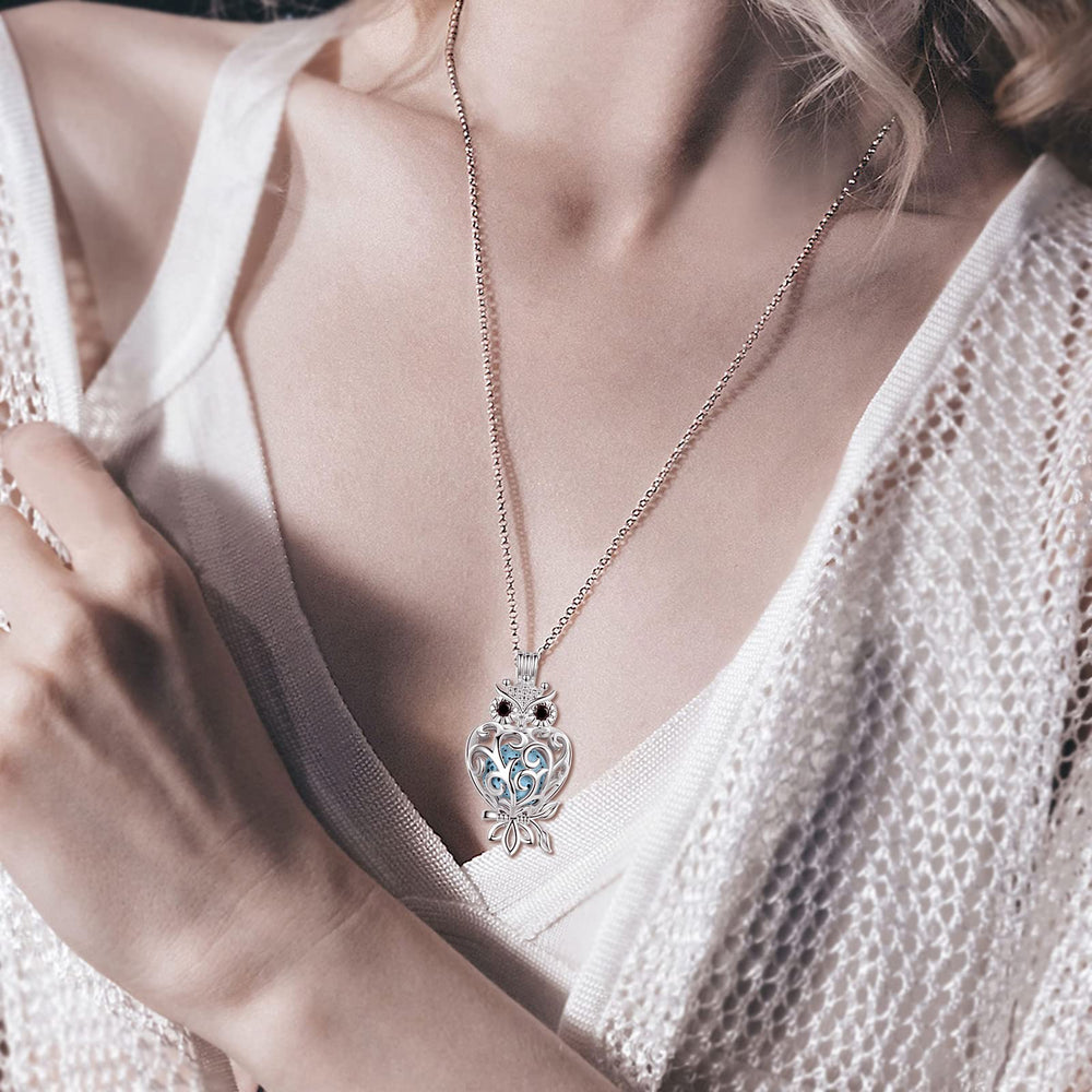 INFUSEU Owl pendant in velvet bag—gift-ready packaging