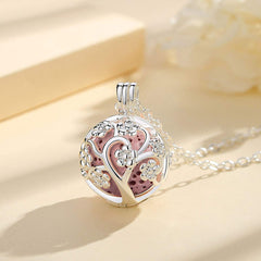 INFUSEU Sakura Tree aroma locket open showing diffuser-ready interior for essential oils.