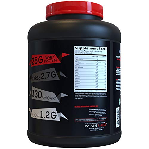 Serving scoop beside Insane Labz Insane Whey powder for precise post-workout intake.