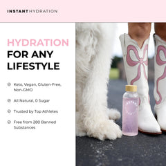 Instant Hydration glass showing a crisp zero sugar pink drink.