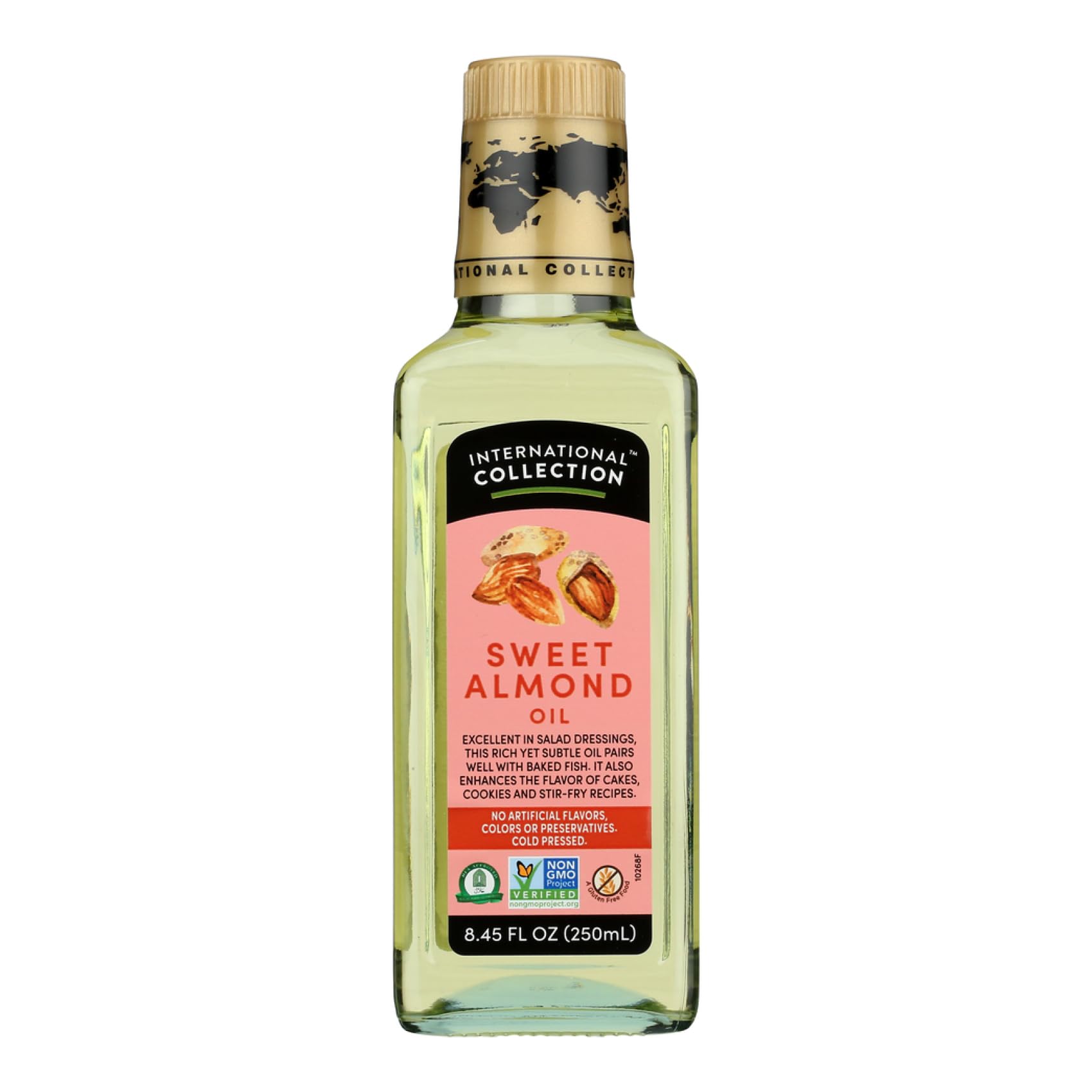 International Collection Almond Oil bottle pouring over salad for light, nutty flavor.