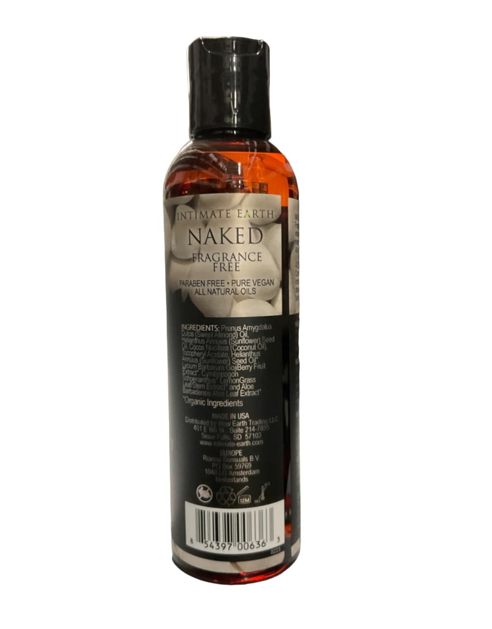 Intimate Earth Naked Massage Oil being poured for a relaxing massage