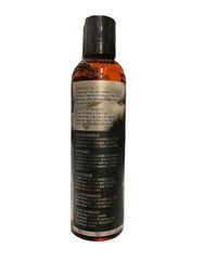 Intimate Earth Naked Massage Oil texture shown on skin during application