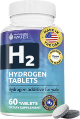Invigorated Water hydrogen tablet dissolving in a glass for quick hydration.