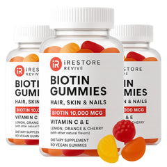 iRestore hair gummy bottle highlighting vegan biotin support for hair and nails.