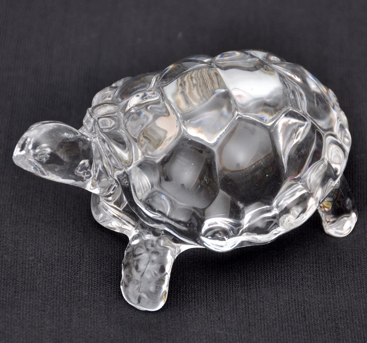 IS4A clear crystal turtle on a living room shelf promotes peace and prosperity.