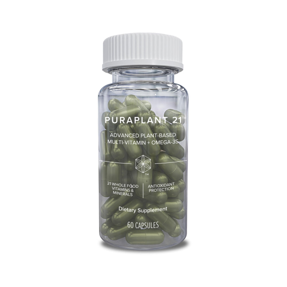 Isagenix PuraPlant21 bottle on a kitchen counter for daily plant-based nutrition.