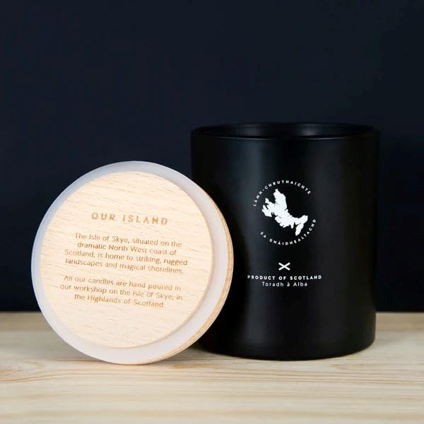 Isle of Skye candle burning and filling a room with sandalwood-patchouli scent