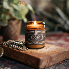 Jackson Vaughn Texas Rodeo 9oz candle jar with warm leather and spice aroma for living spaces.