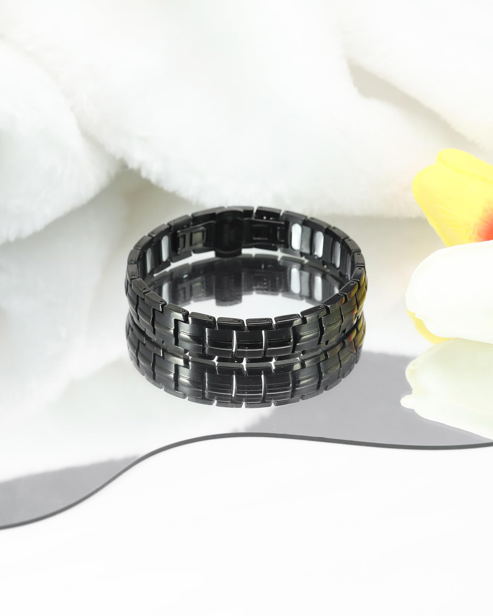 Jecanori black magnetic bracelet close-up on wrist.