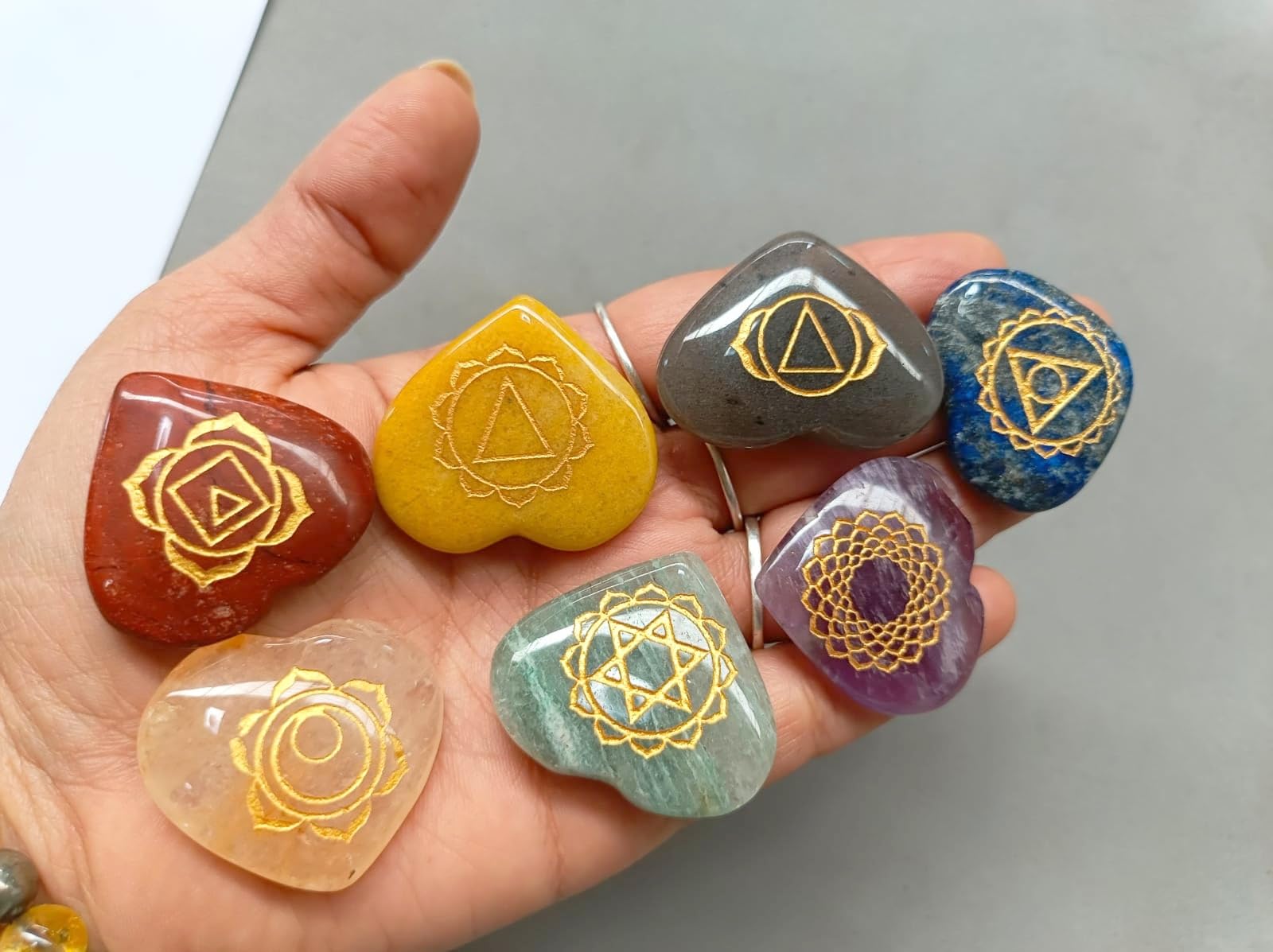 Jet International 7 Chakra Heart Stone Set red jasper close-up for root chakra grounding.