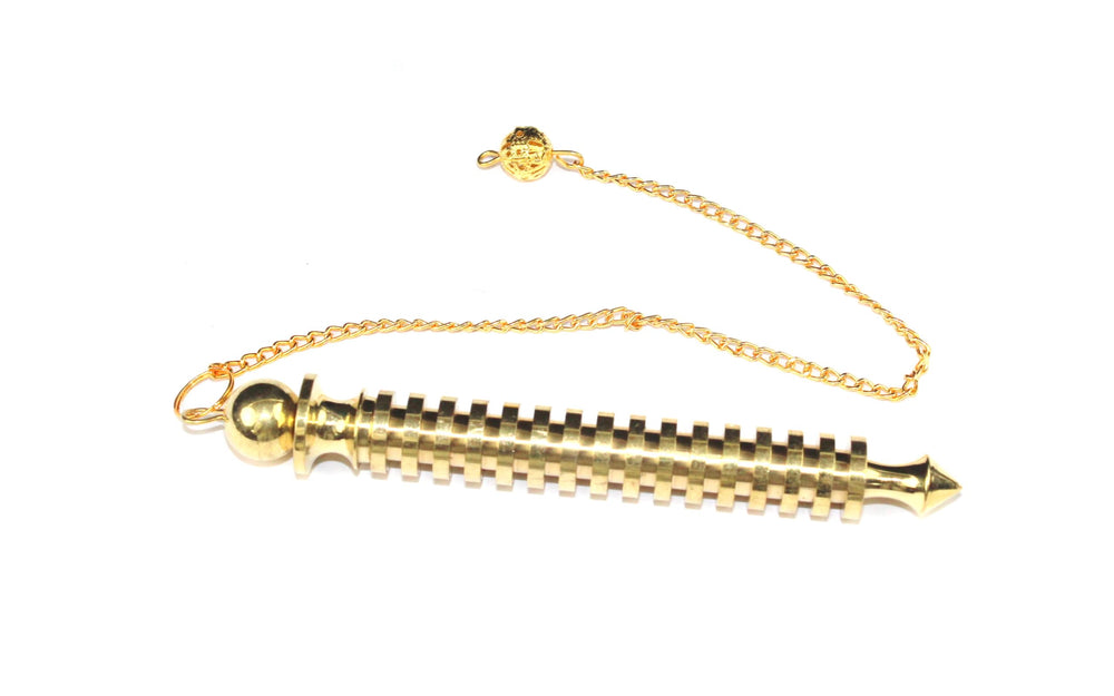 Jet International ISIS brass pendulum in a calm meditation scene.