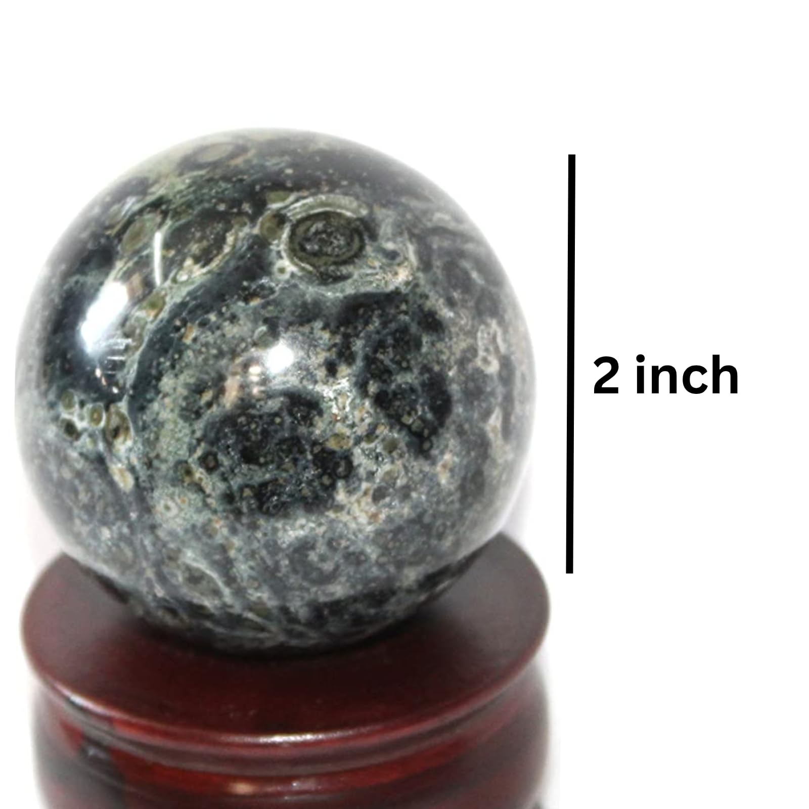 Jet International Kambaba Jasper sphere in hand demonstrates portable meditation companion.
